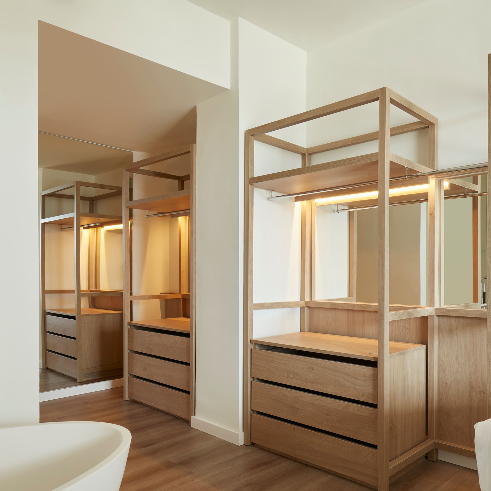 a bathroom with a tub and a mirror