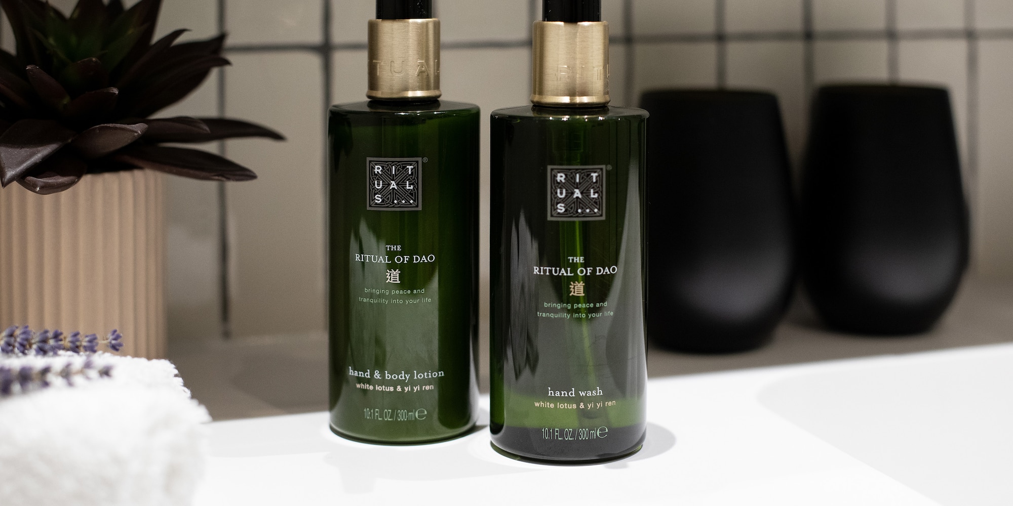 a couple of green bottles on a white counter