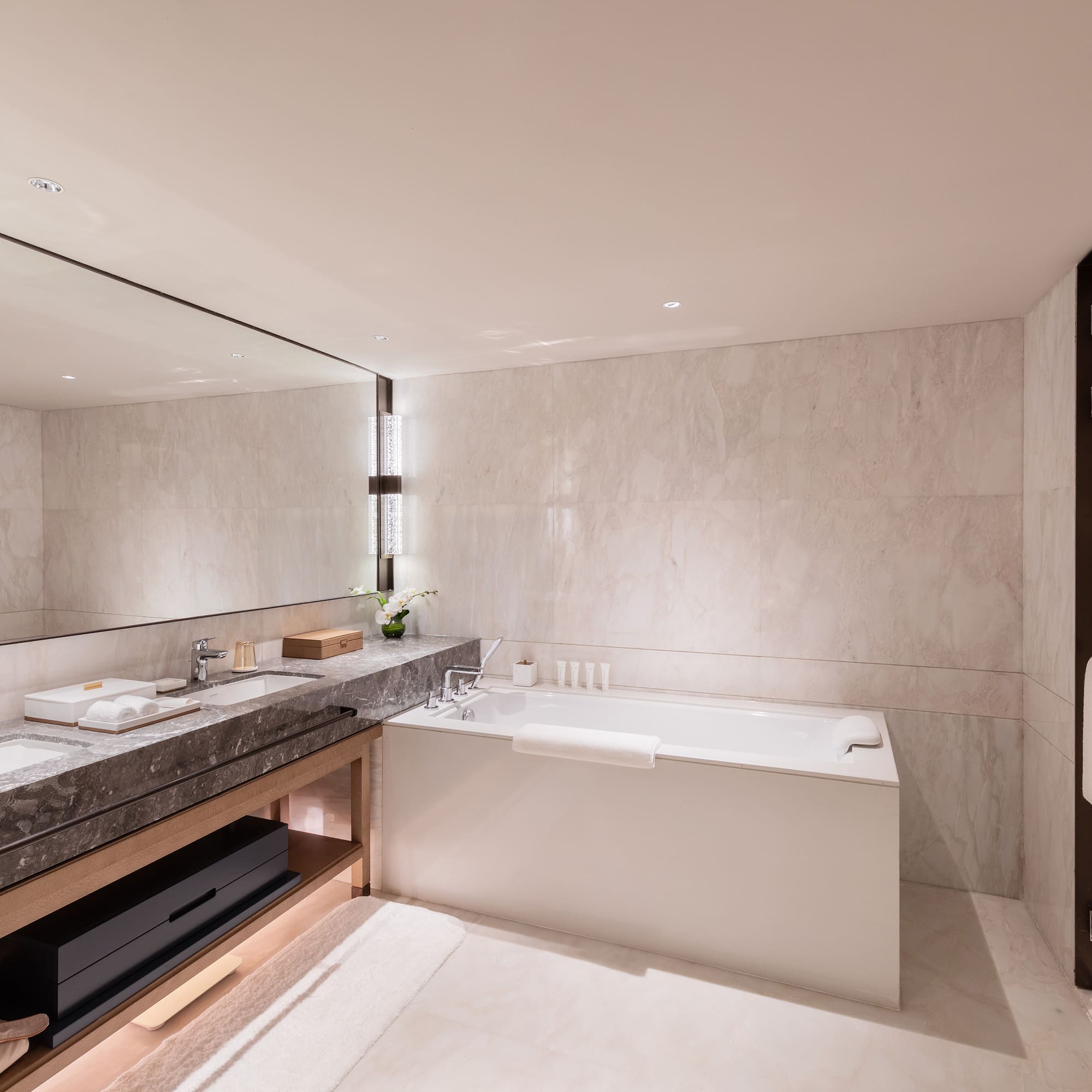 a bathroom with a bathtub and sink