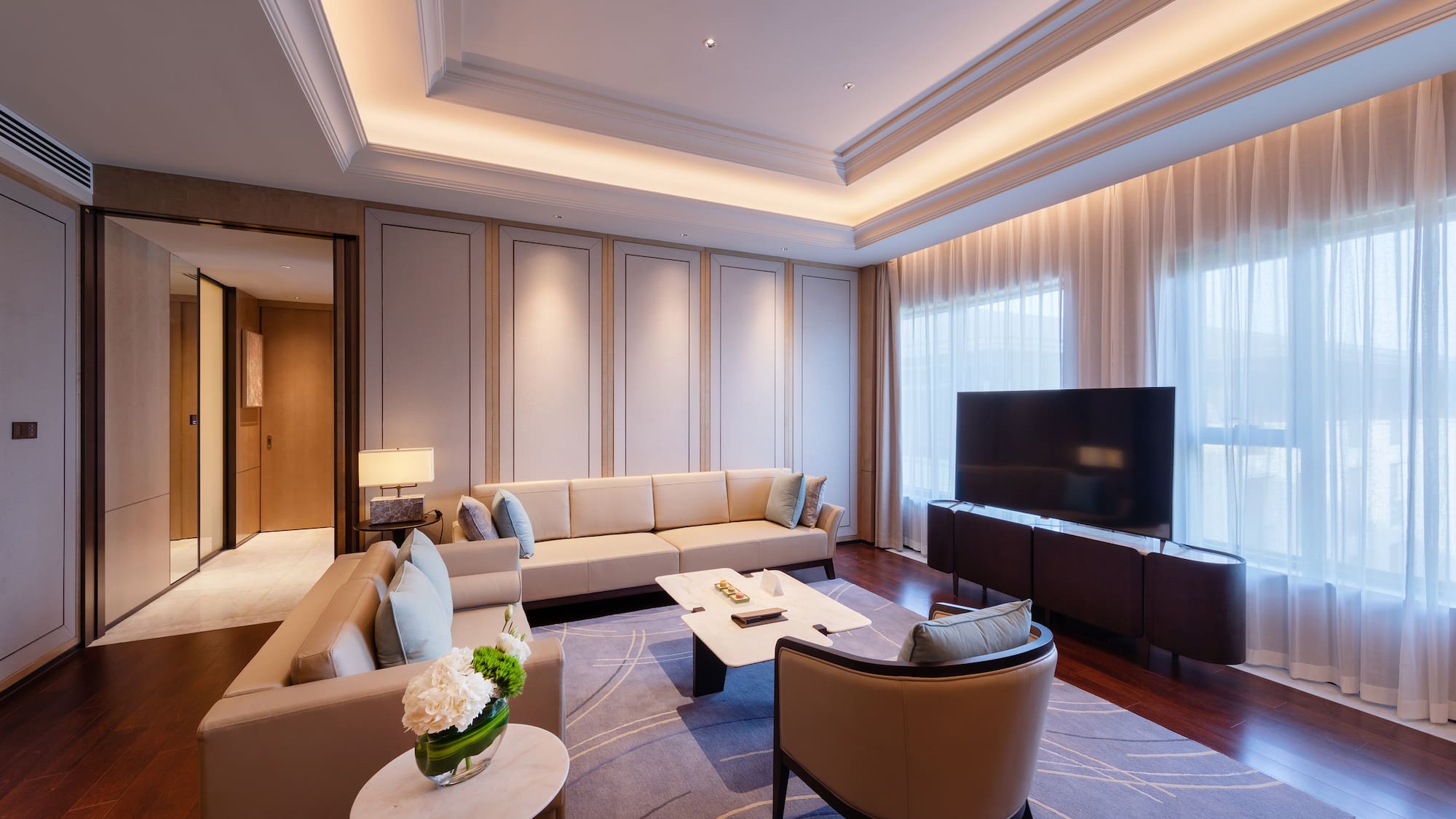 a room with a television and couches