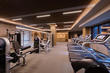 a room with treadmills and exercise equipment