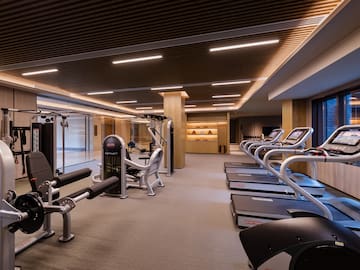 a room with treadmills and exercise equipment