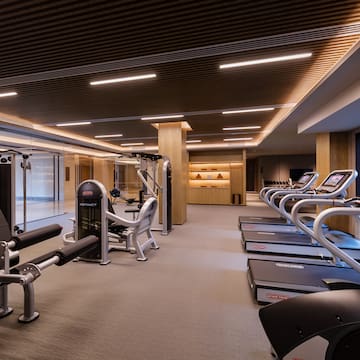 a room with treadmills and exercise equipment