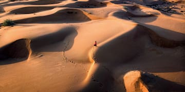 a person walking in the desert