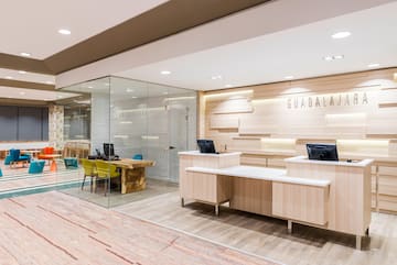 a reception desks and a glass wall