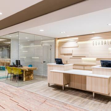 a reception desks and a glass wall
