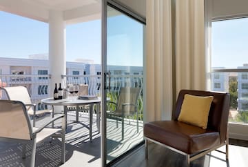 a patio with a table and chairs