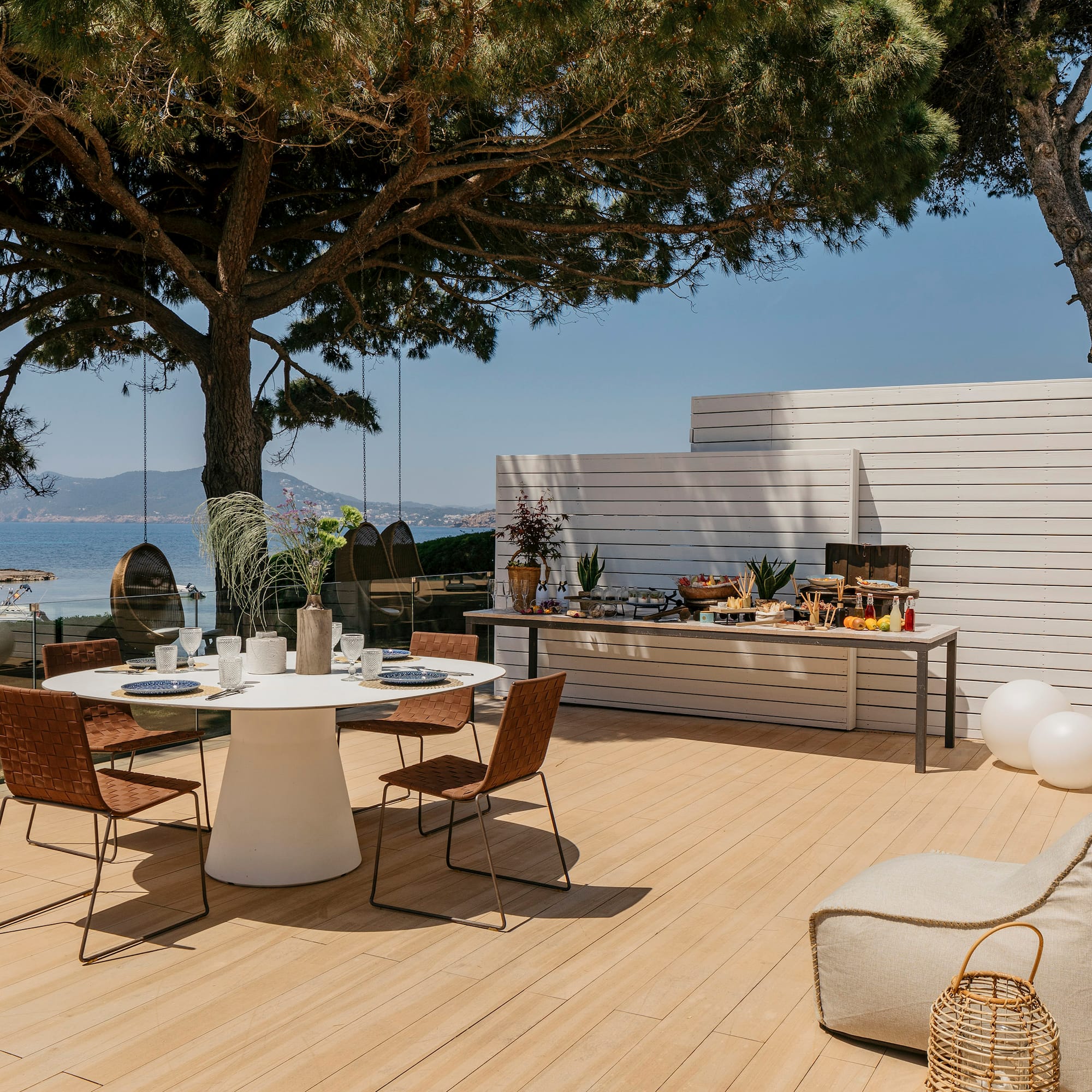 a table and chairs on a deck