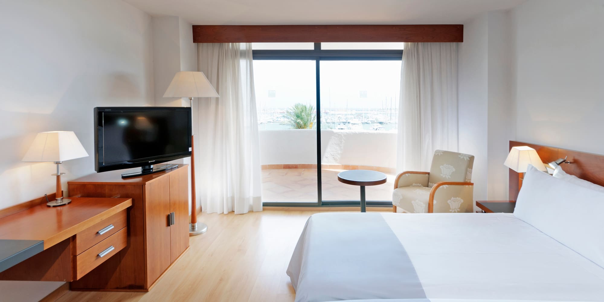 a room with a television and a bed