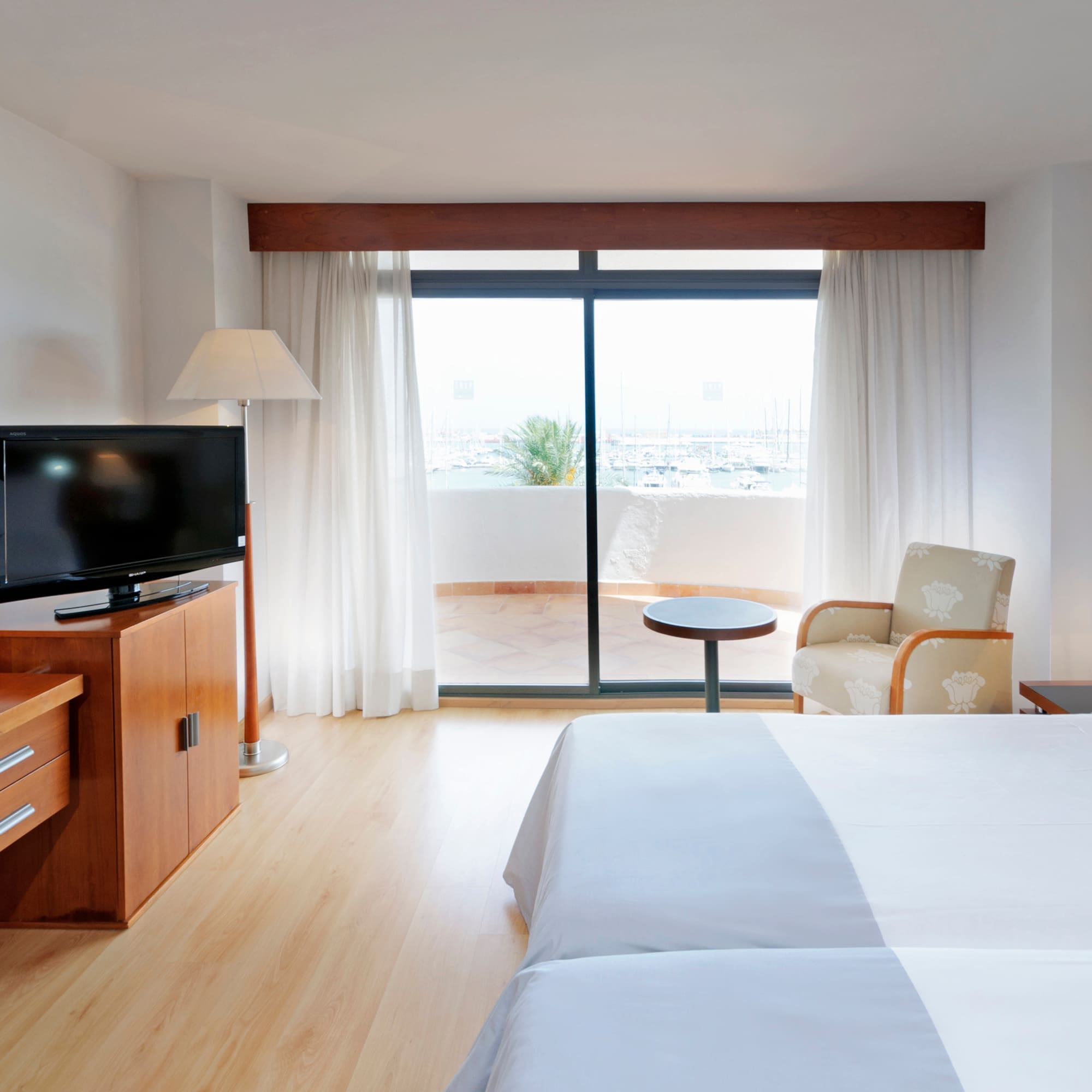 a room with a television and a bed