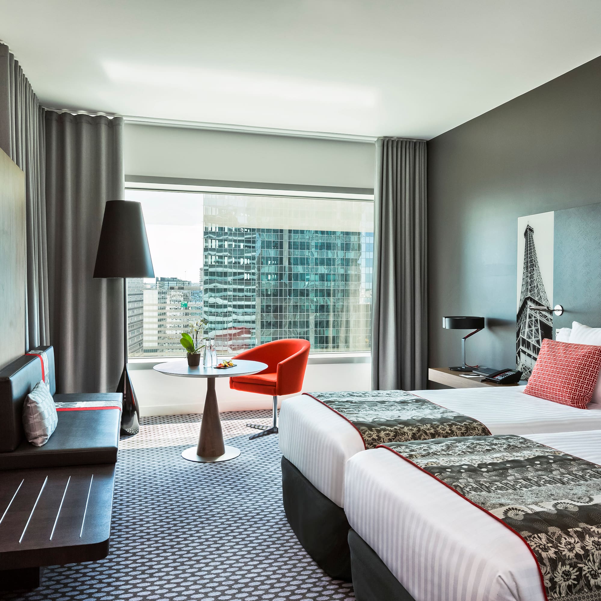 a room with two beds and a table