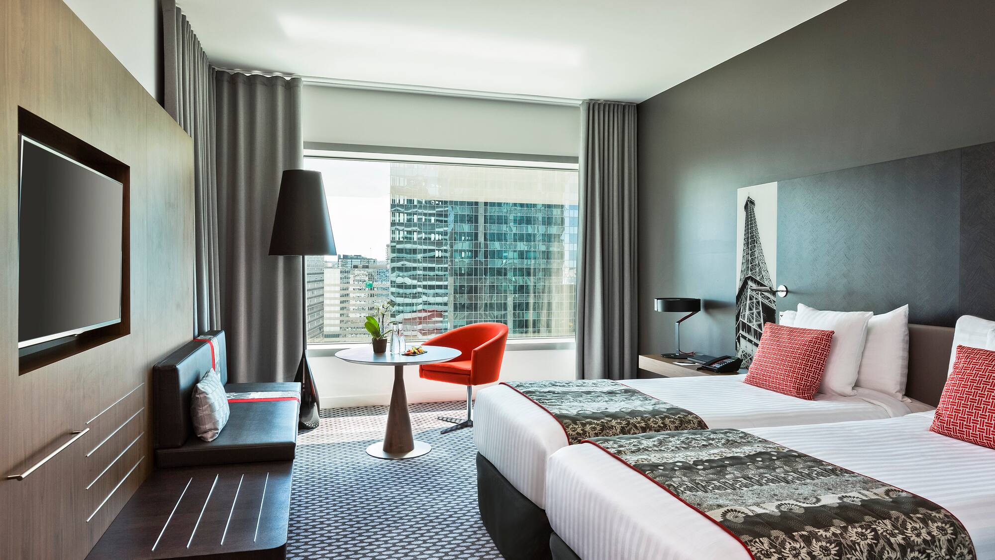 a room with two beds and a table