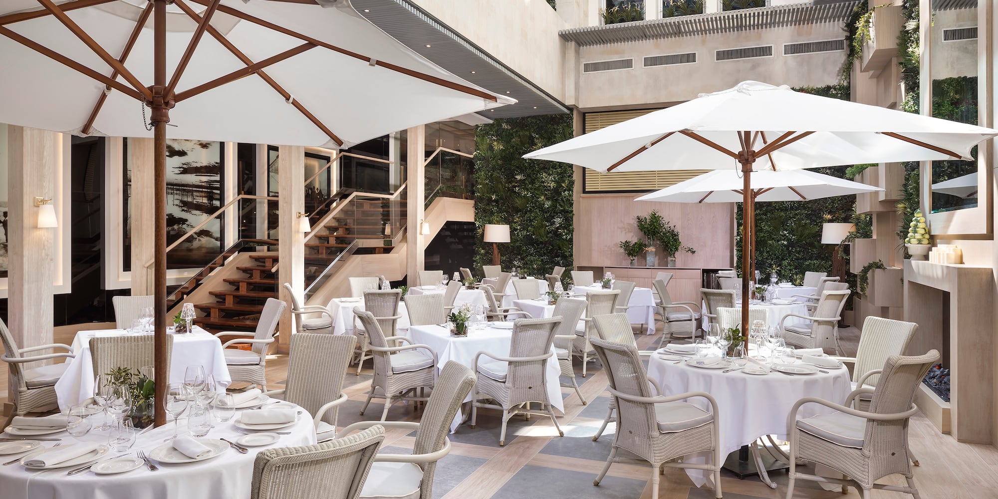 a patio with tables and chairs