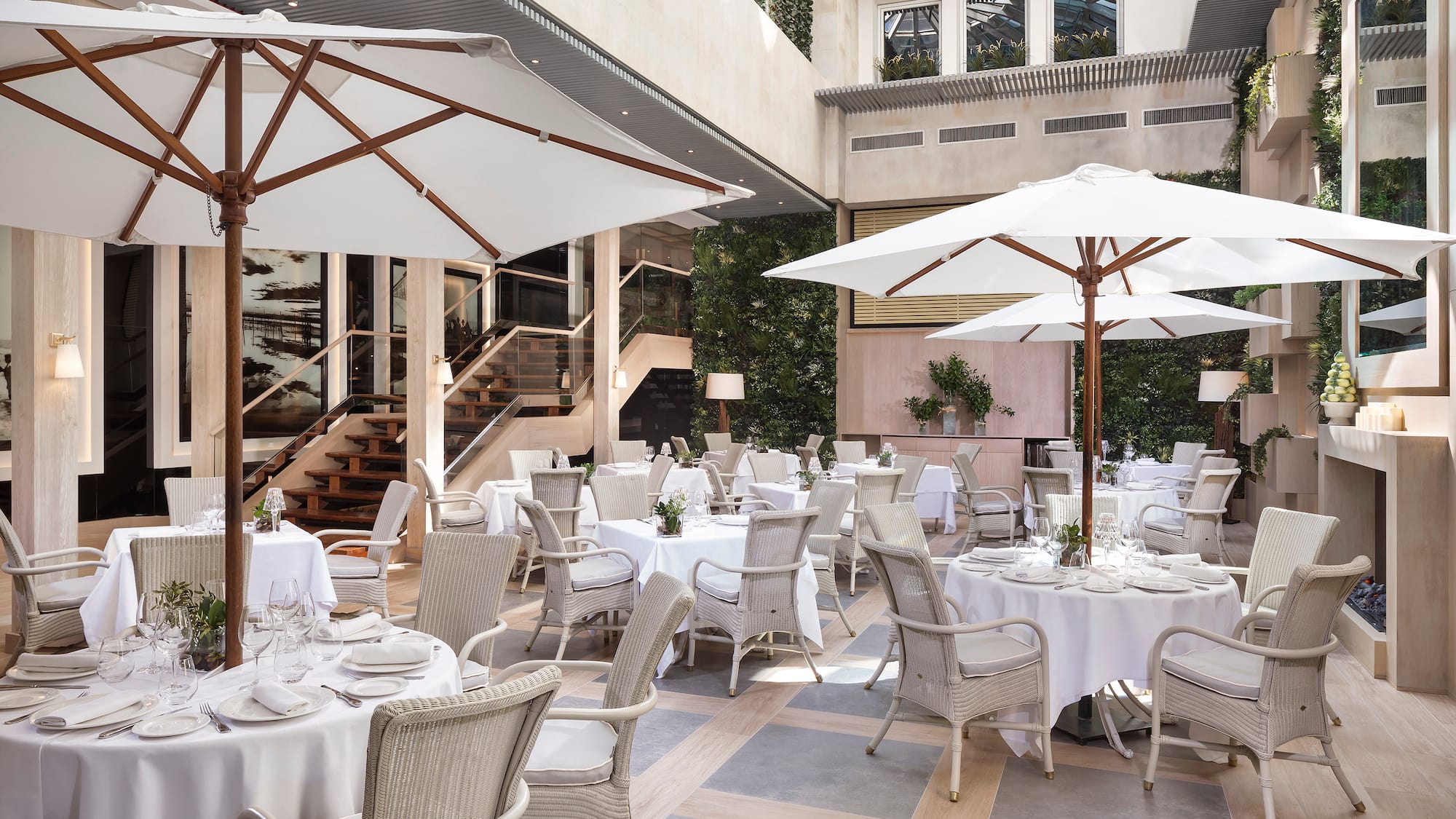 a patio with tables and chairs