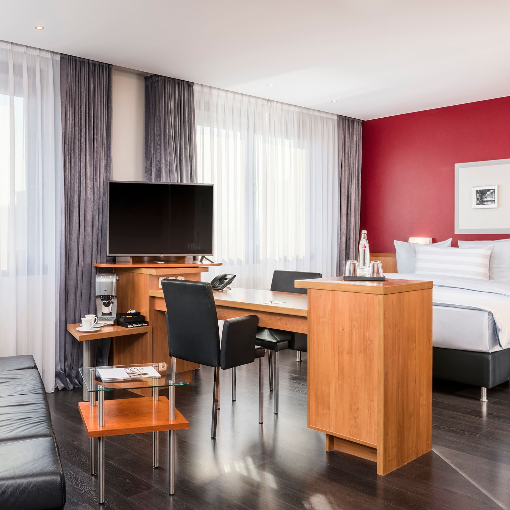 a room with a bed and a tv