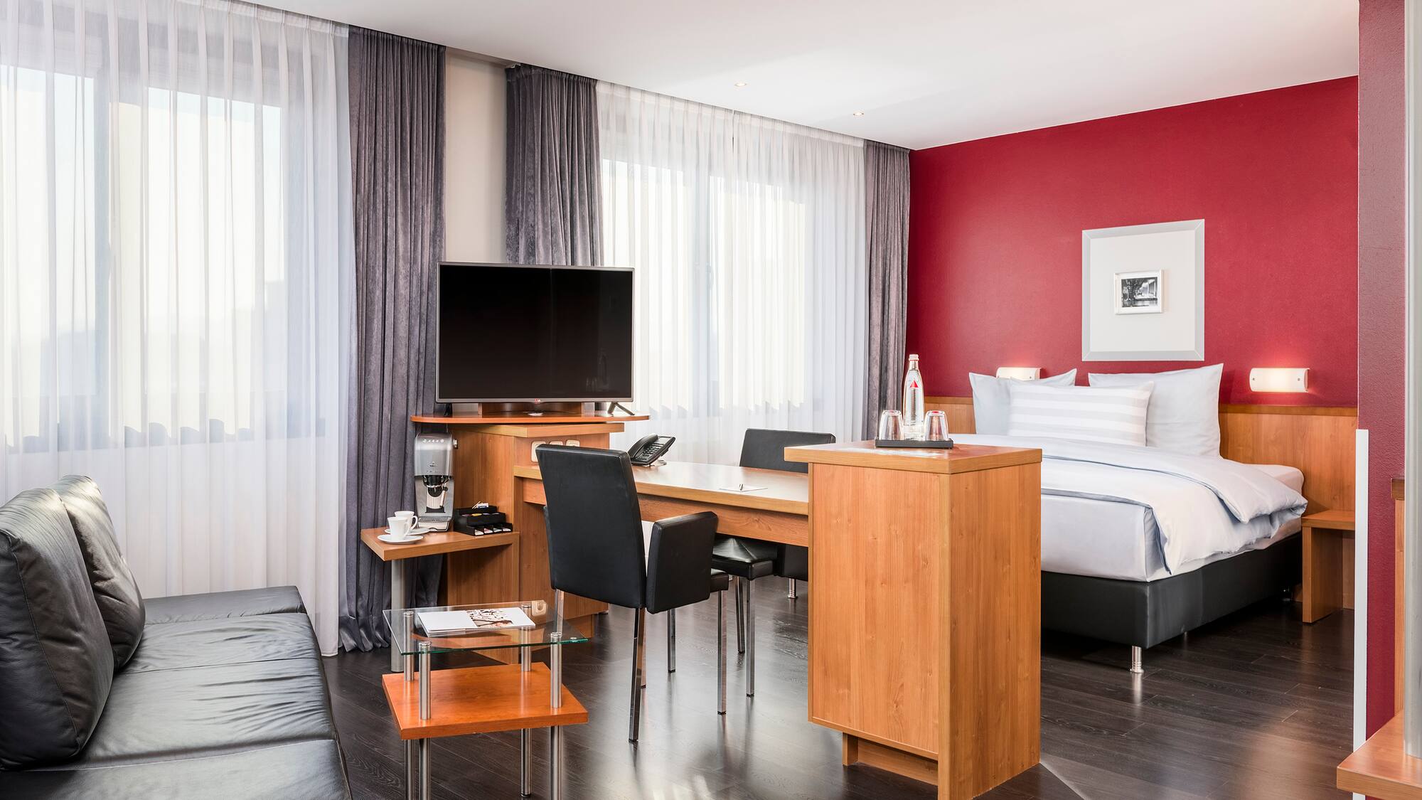 a room with a bed and a tv