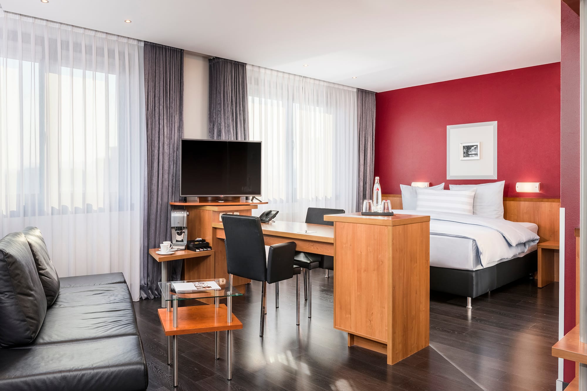 a room with a bed and a tv