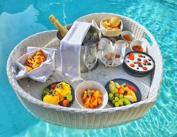 a basket of food on a pool