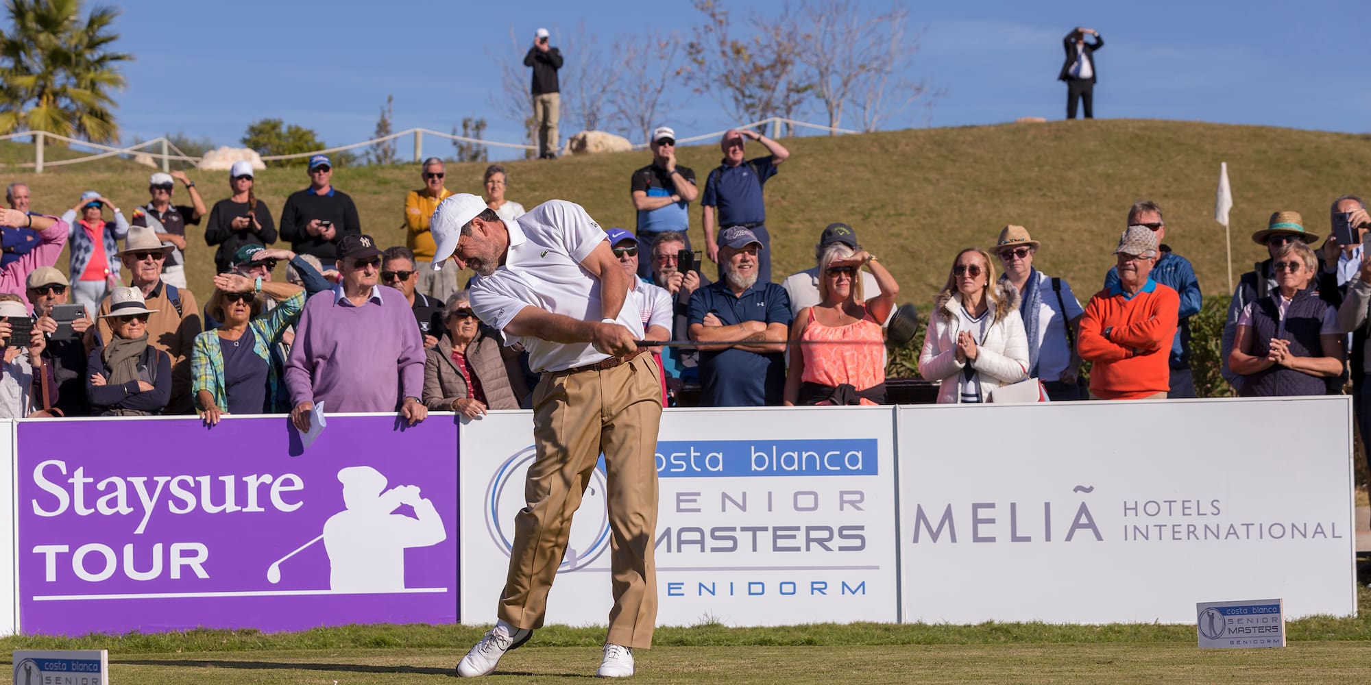 a man swinging a golf club