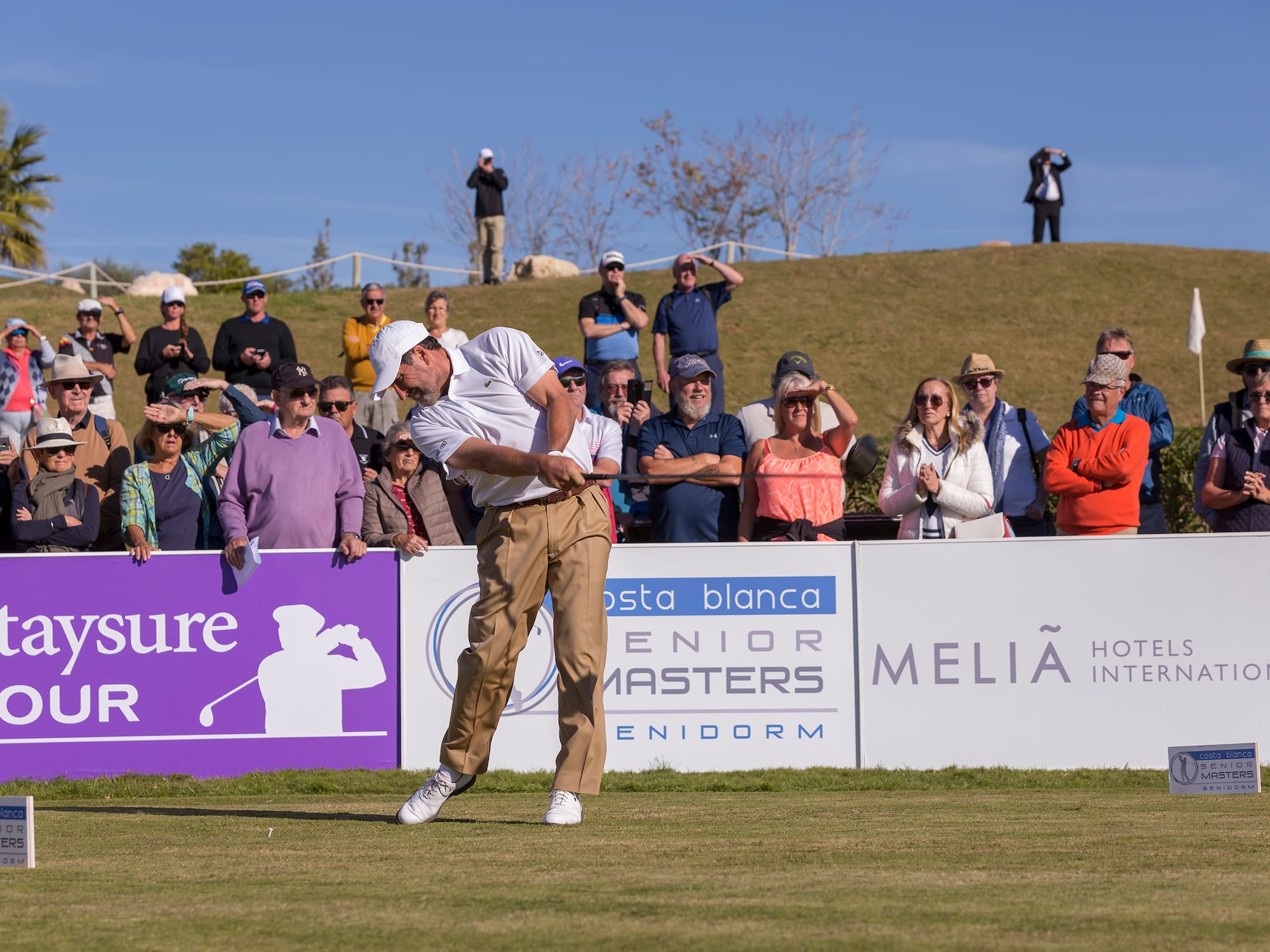 a man swinging a golf club
