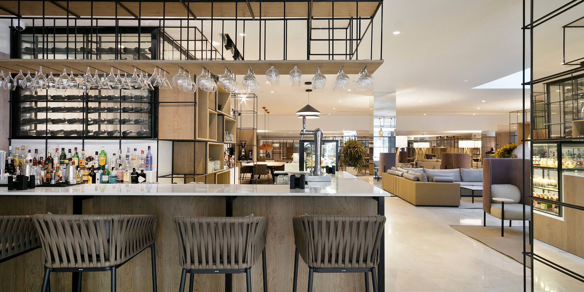 a bar with chairs and a bar stools