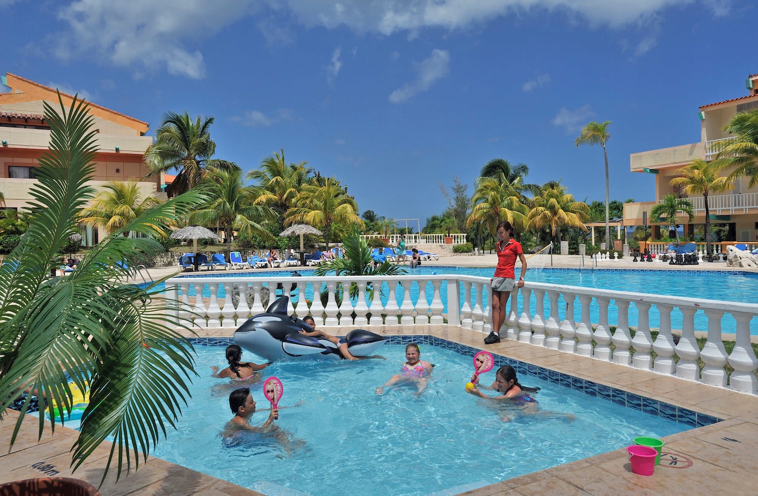 a group of kids in a pool
