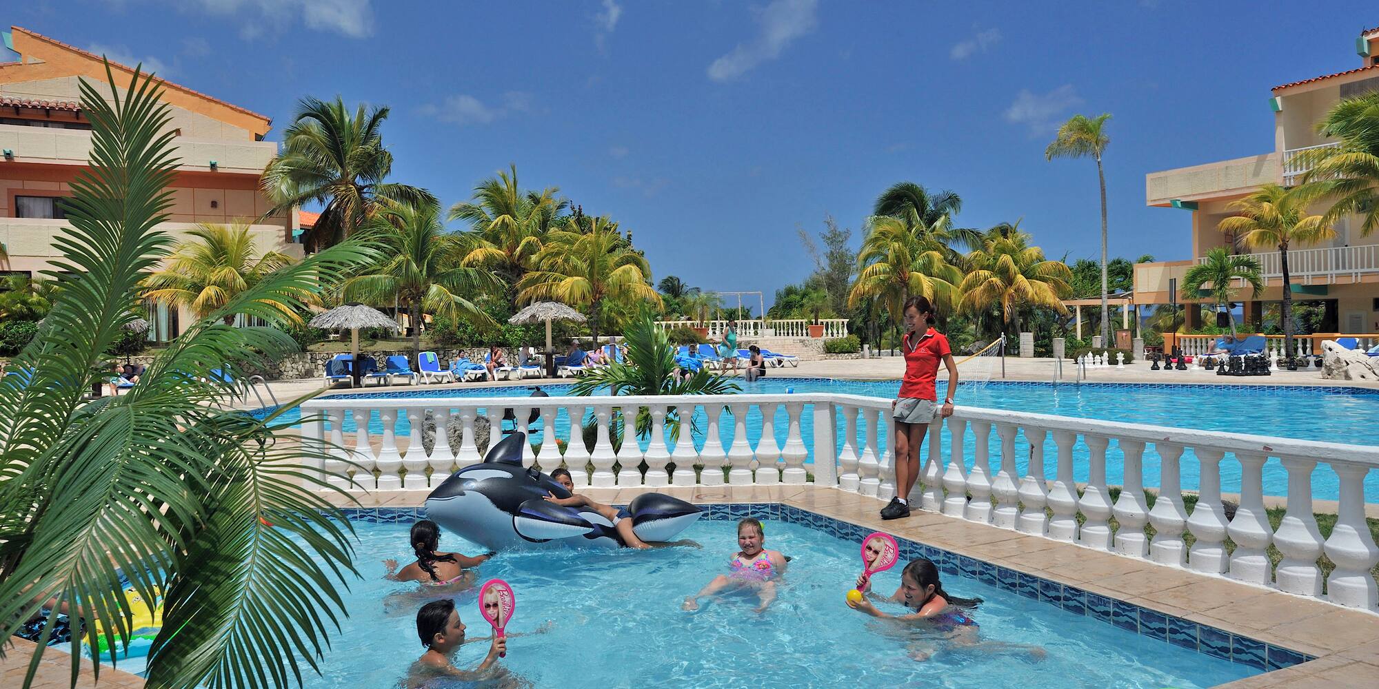 a group of kids in a pool