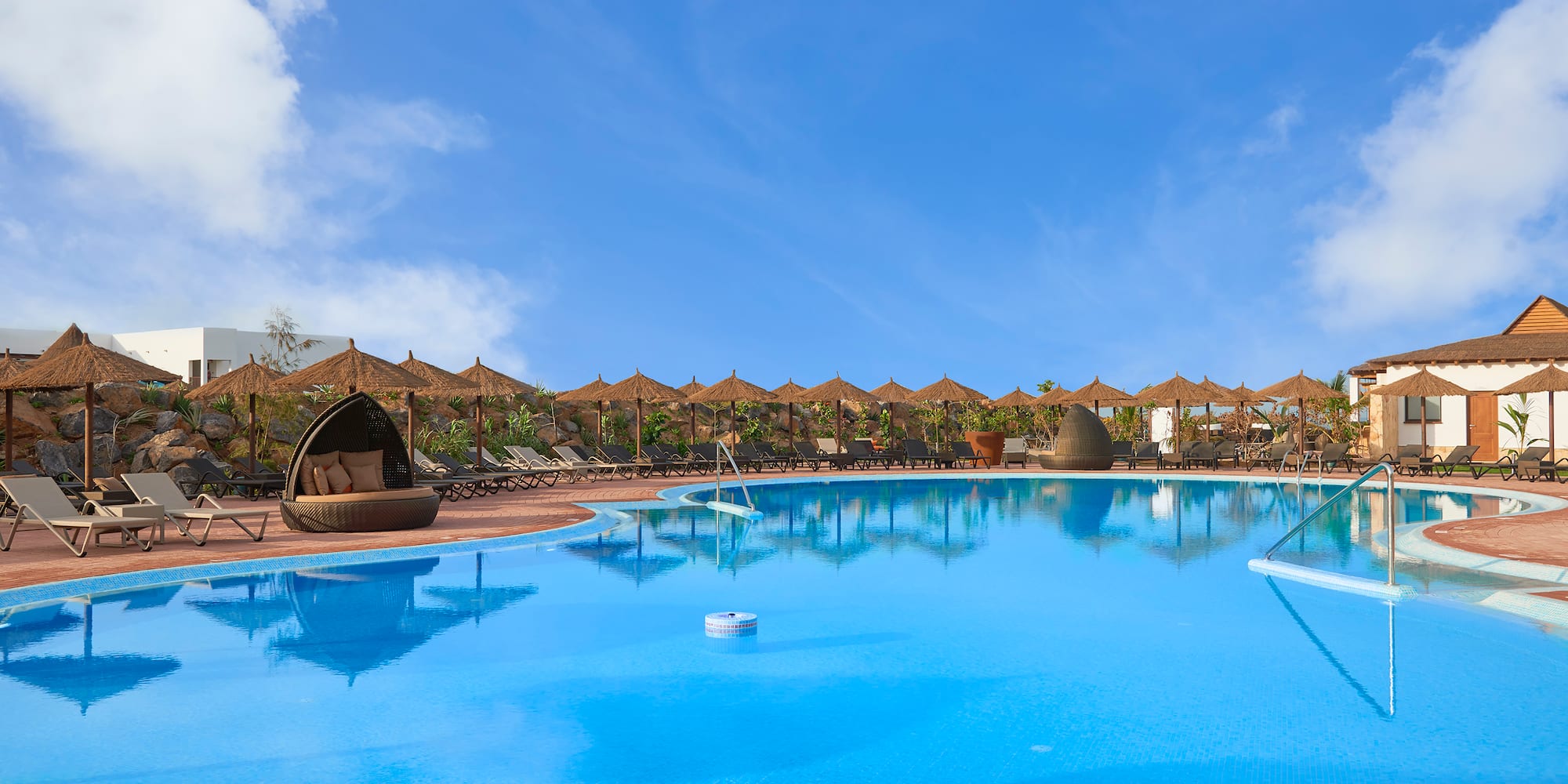 a pool with a large body of water