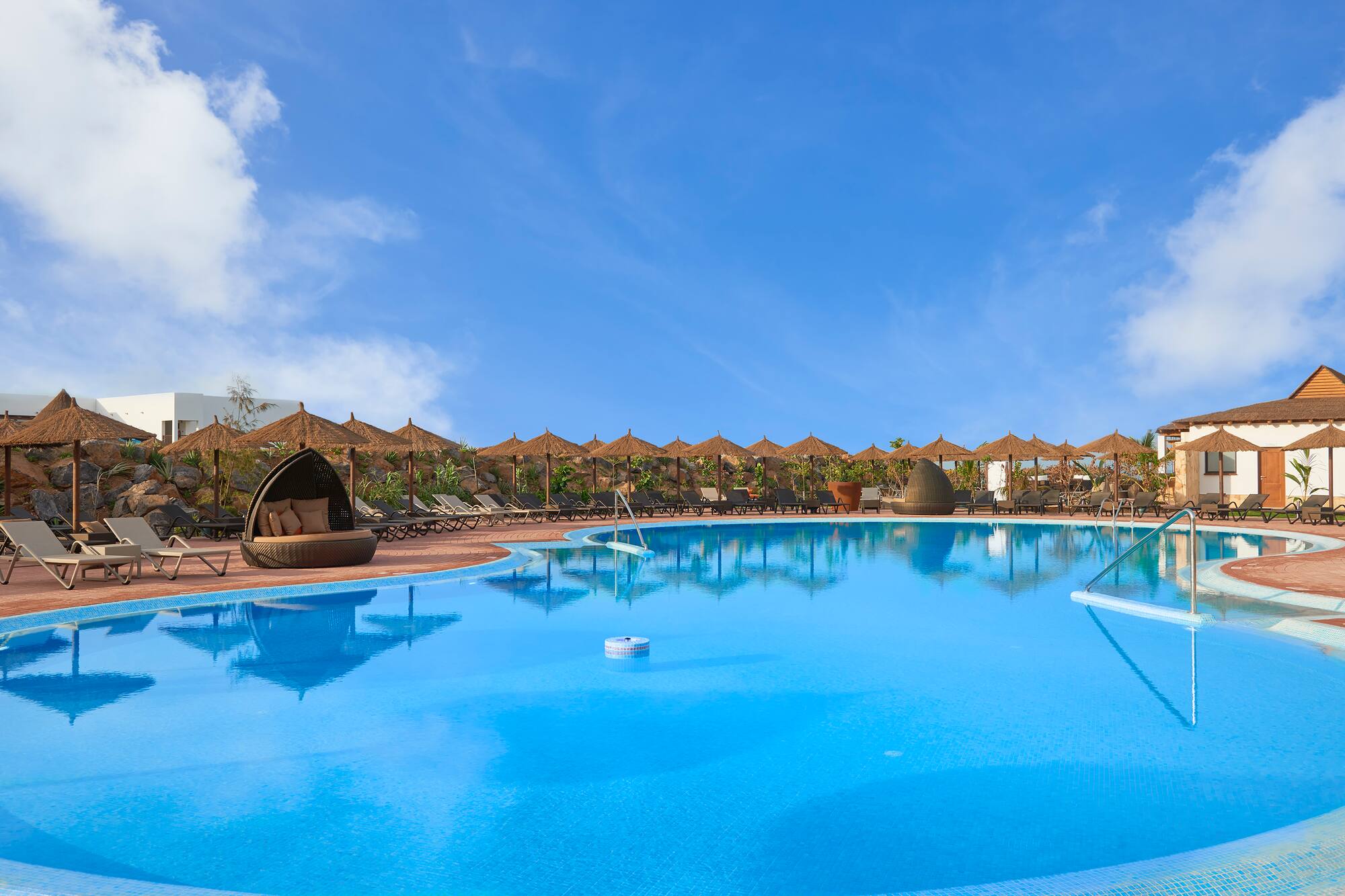 a pool with a large body of water
