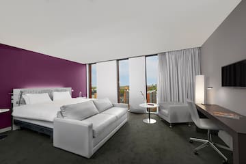 a room with a bed and a desk