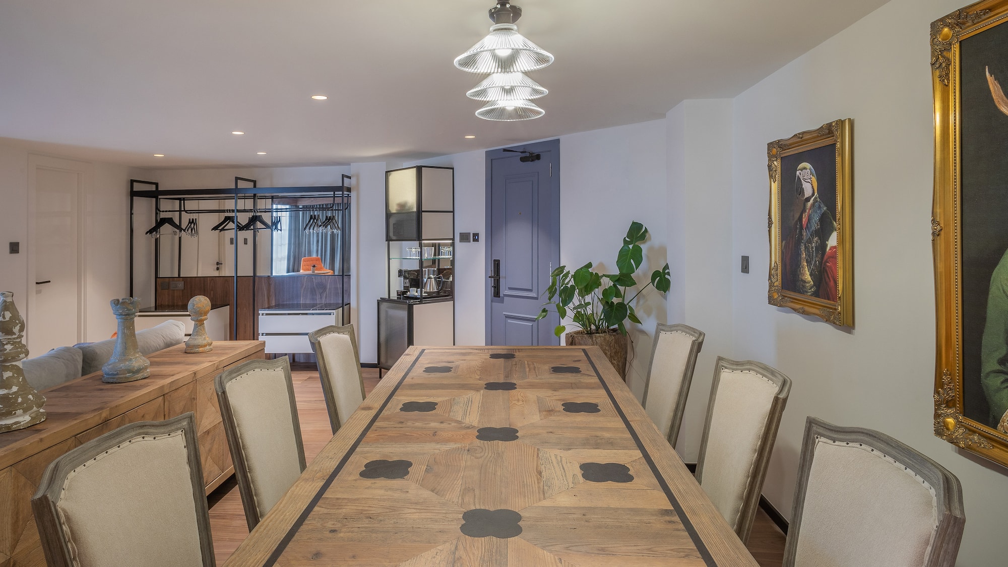 a room with a large table and chairs