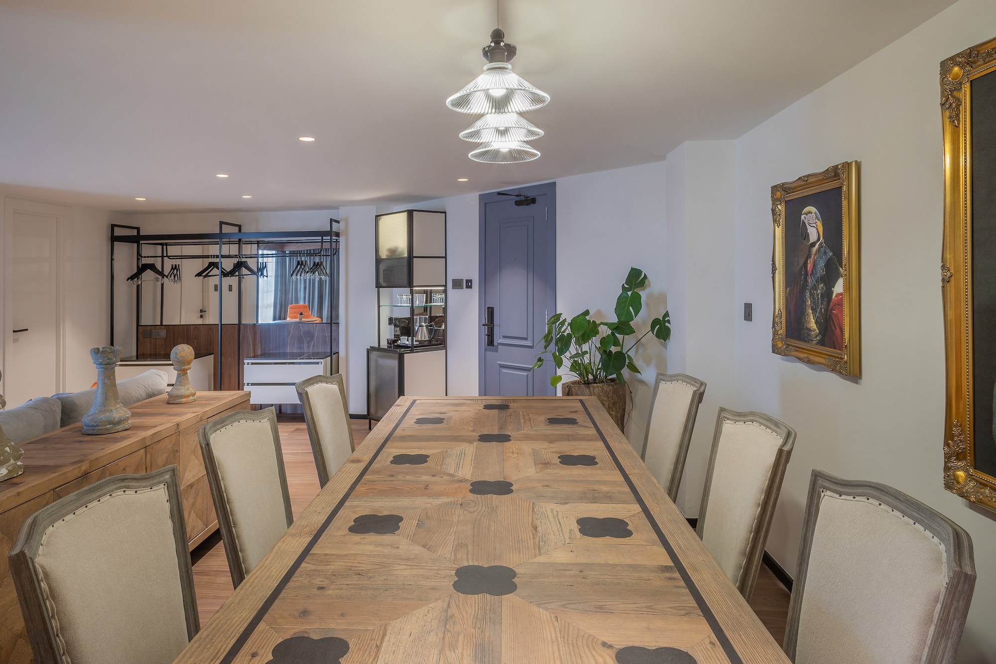 a room with a large table and chairs