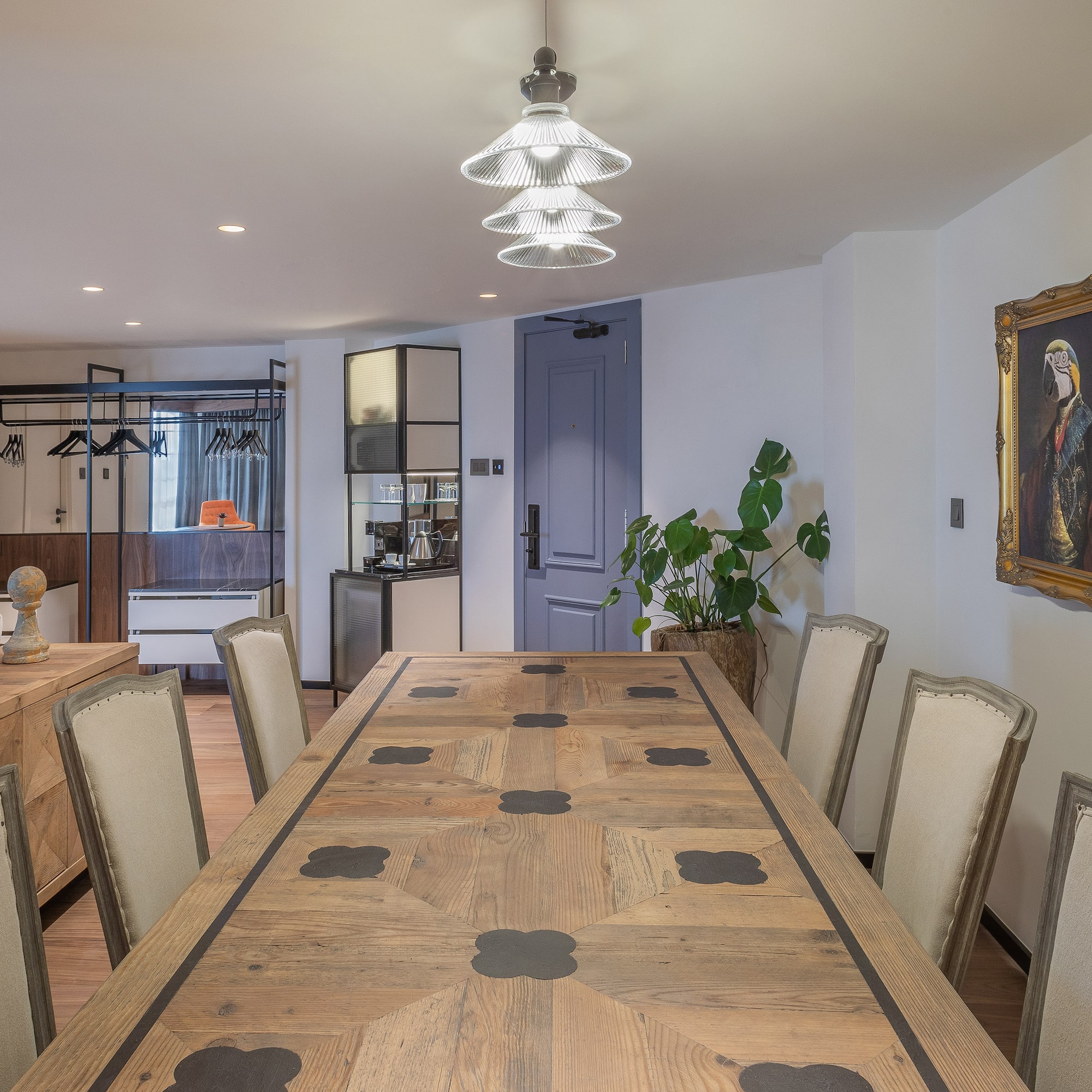 a room with a large table and chairs