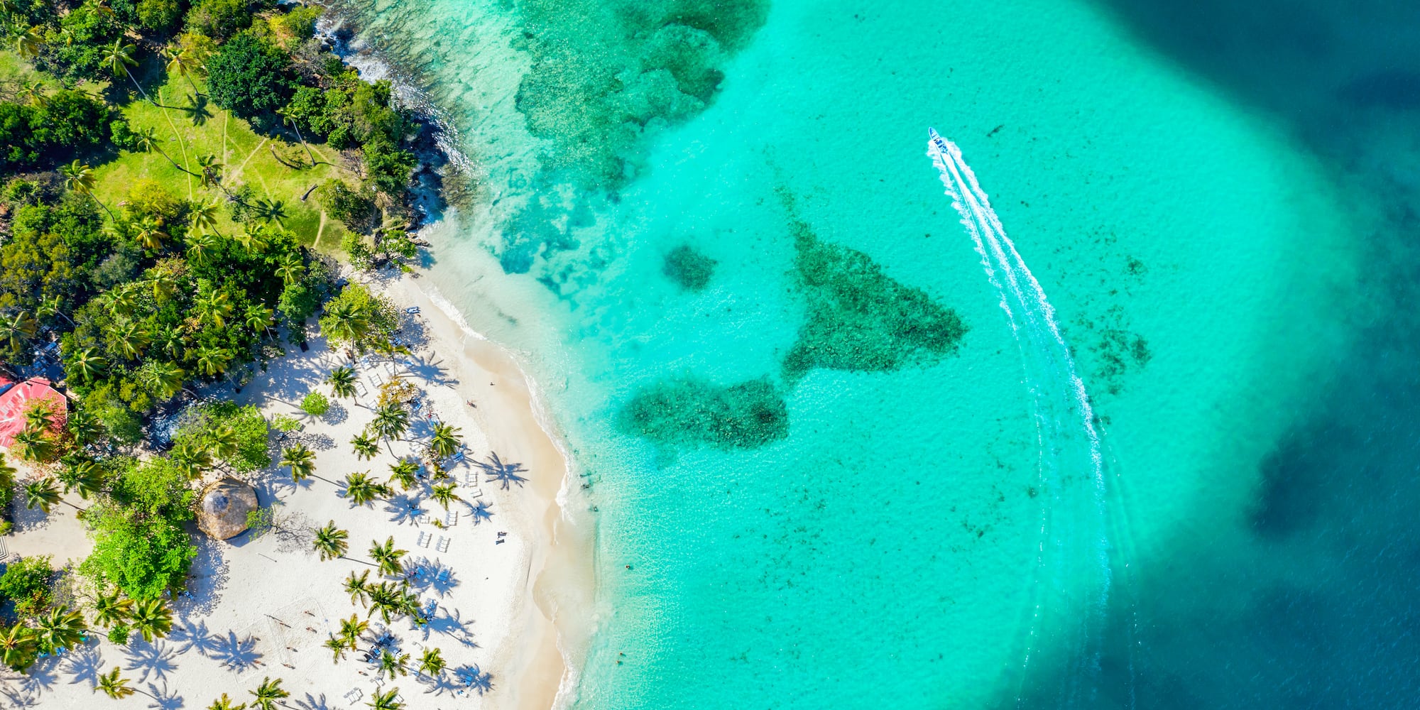 a beach with a boat in the water