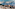 a city with a castle and mountains in the background