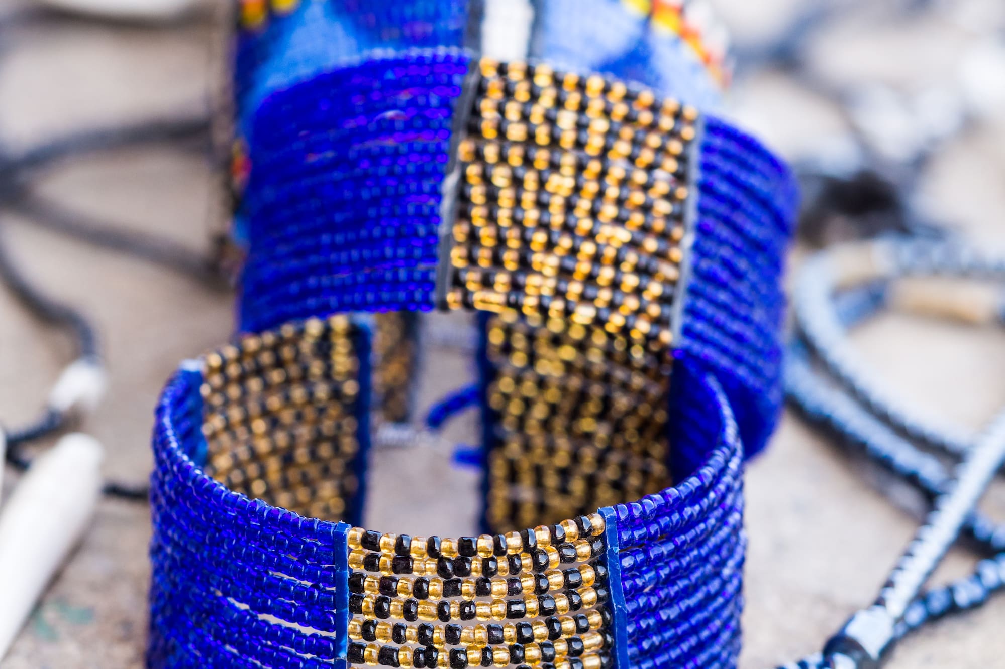 a group of blue bracelets