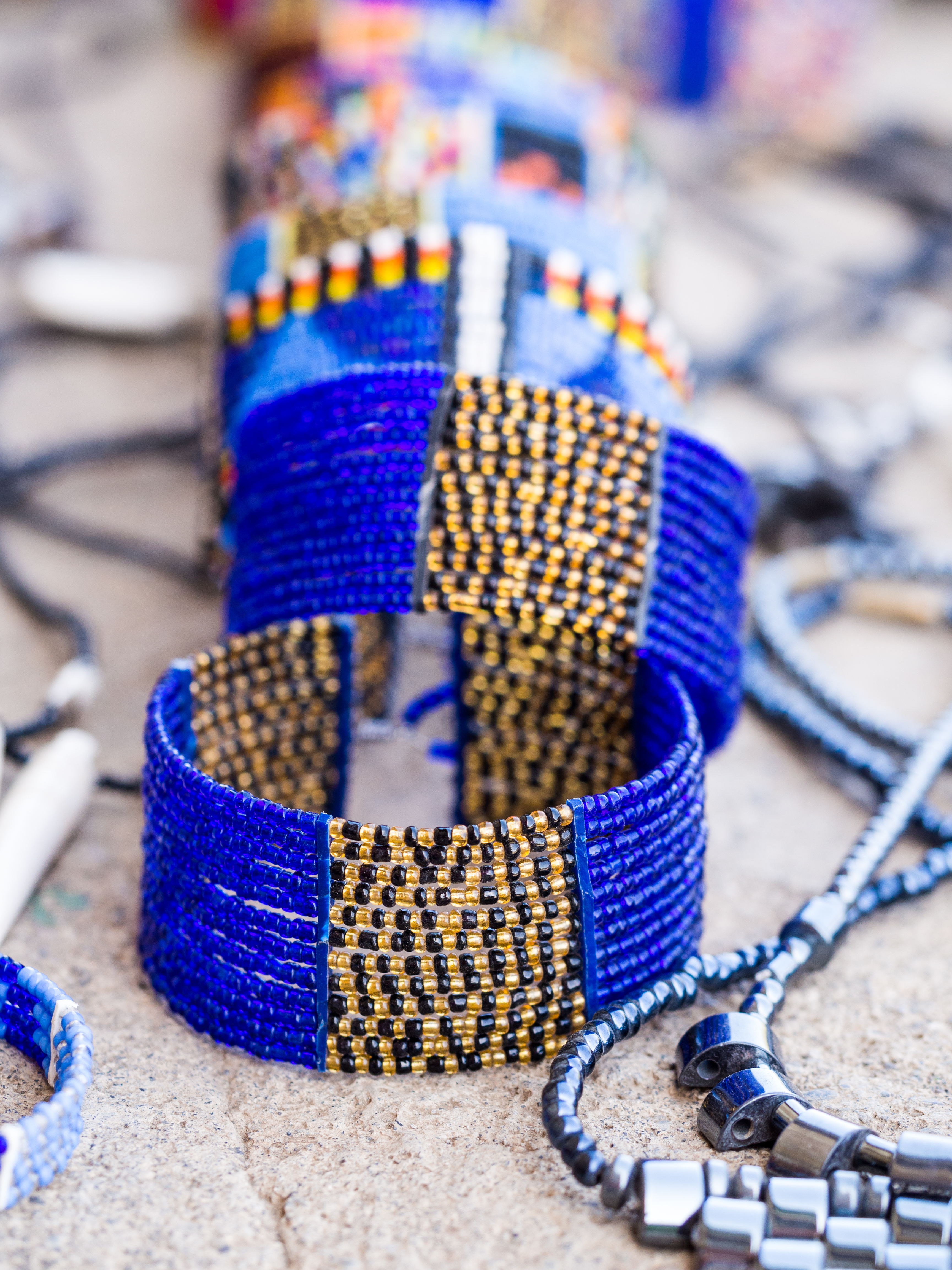 a group of blue bracelets