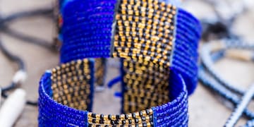 a group of blue bracelets