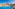 Colorful Mediterranean luxury resort with a large outdoor swimming pool.