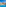 Luxury resort pool with Mediterranean-style buildings under a clear blue sky.