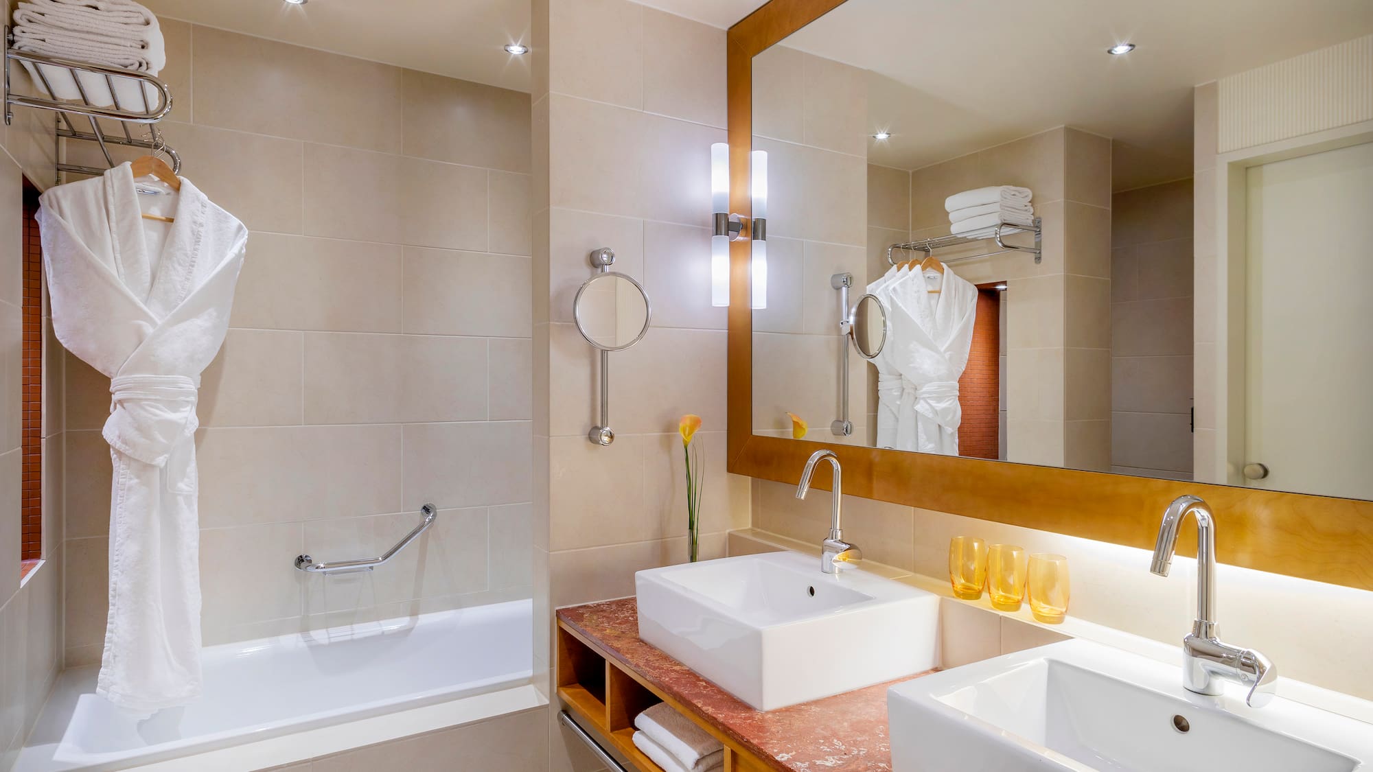 a bathroom with a mirror and sink