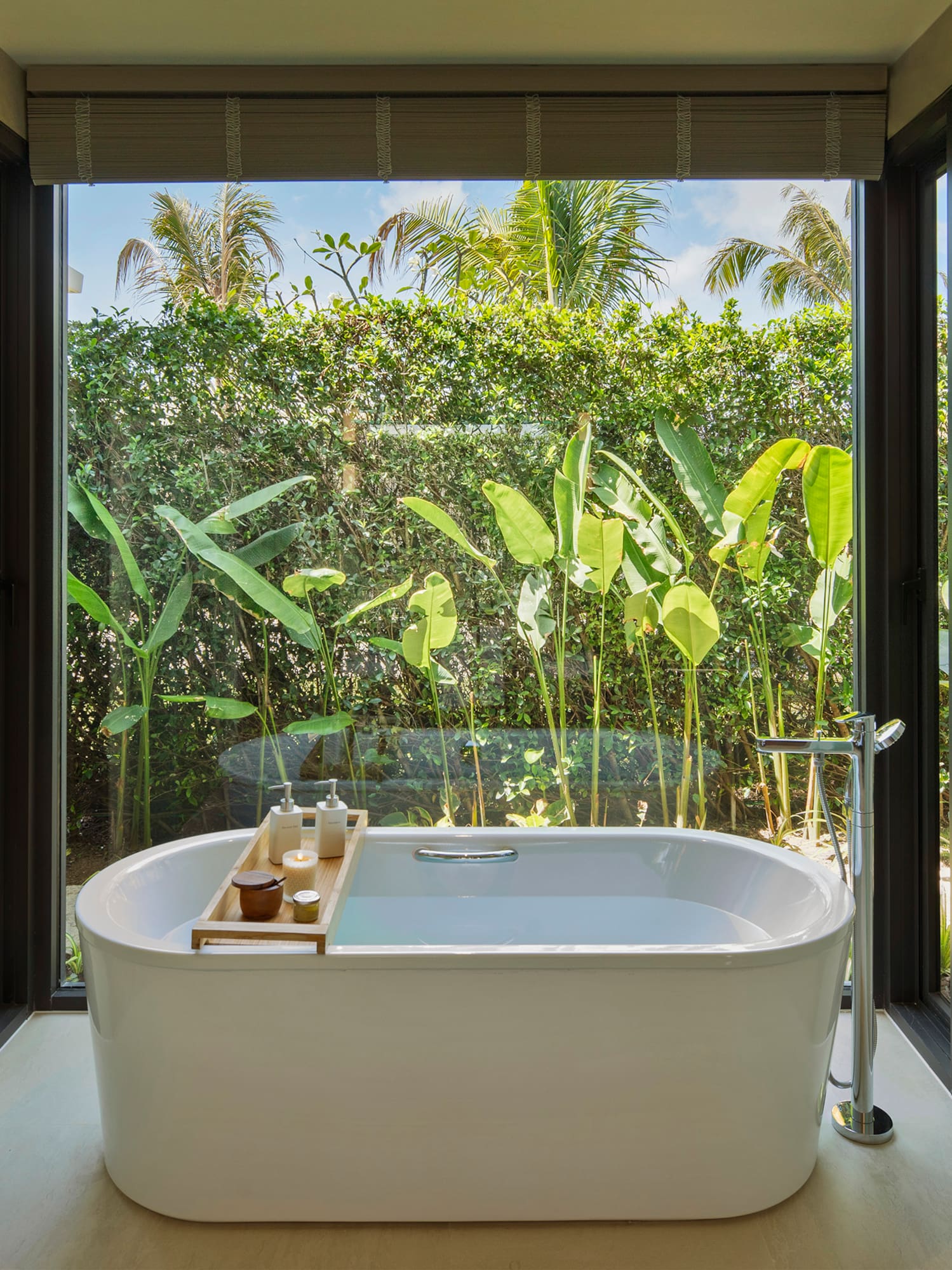 a bathtub in a bathroom with a window