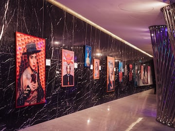 a hallway with pictures on the wall