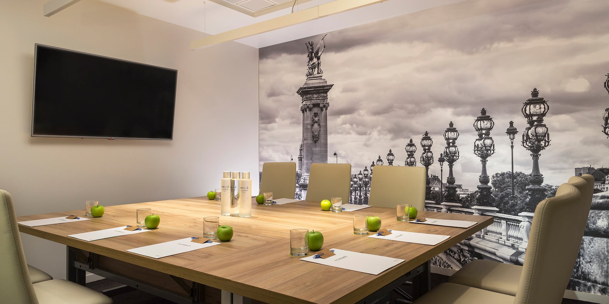 a table with chairs and apples on it