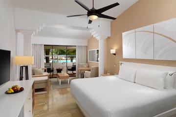a room with a bed and a ceiling fan