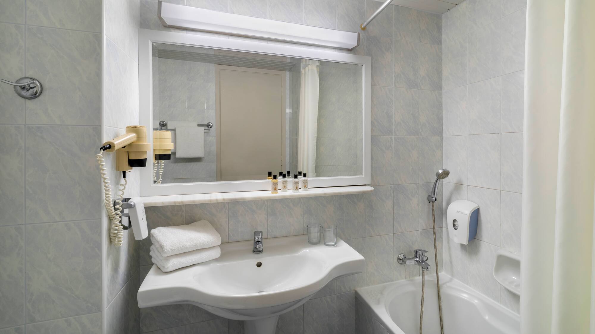 a bathroom with a sink and bathtub