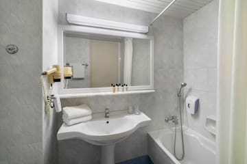 a bathroom with a sink and bathtub