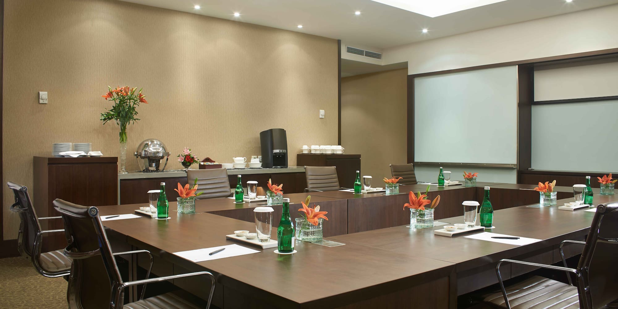 a conference room with a large table and chairs
