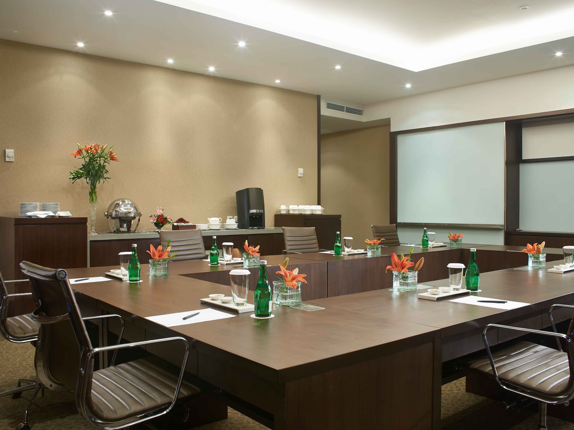 a conference room with a large table and chairs
