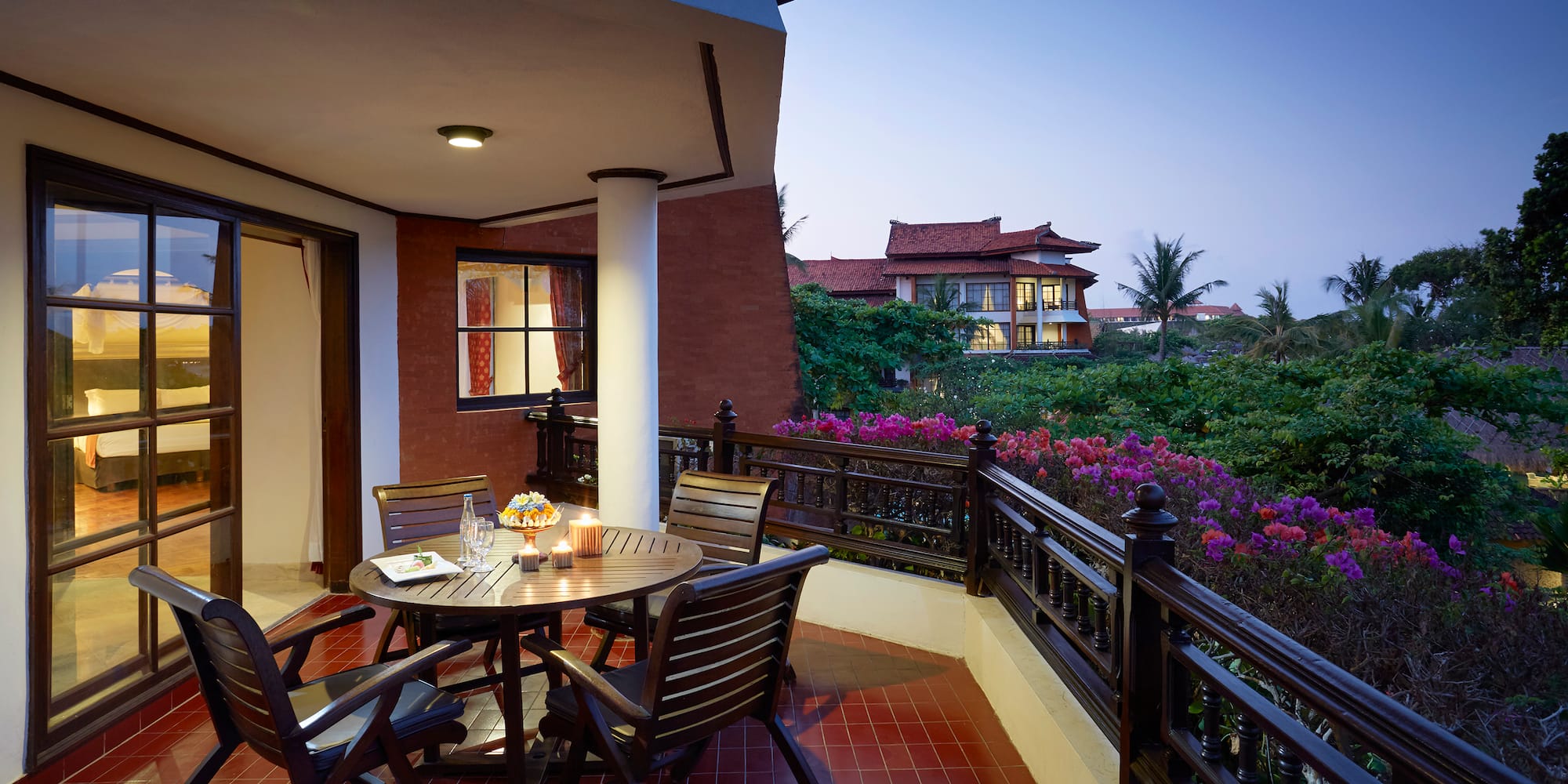 a table and chairs on a balcony